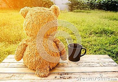 Sweet Teddy bear with cup of coffee Stock Photo