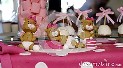 Sweet teddy bears on a pink birthday cake Stock Photo