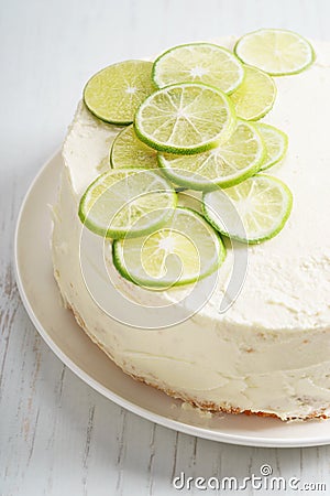 Sweet white buttercream cake with sliced lime on top Stock Photo