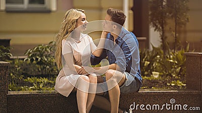 Sweet young lady touching beloved mans face tenderly, love story, relationship Stock Photo