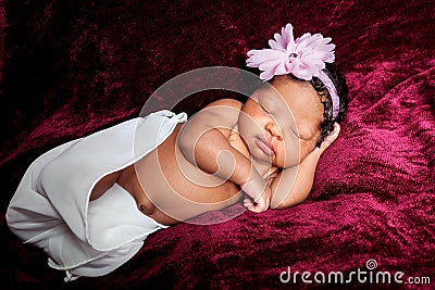 Sweetly Sleeping African American Newborn Girl Stock Photo