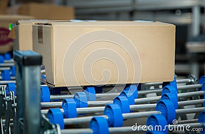 Sweets factory. Sweets production process. Conveyor belt with boxes of chocolates on it Stock Photo