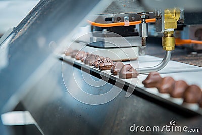 Sweets factory. Sweets production process. Conveyor belt with sweets on it Stock Photo