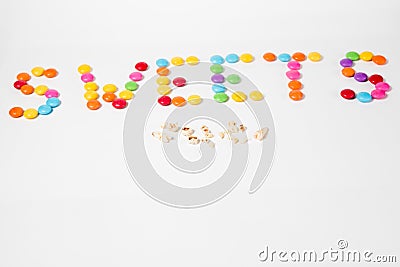 SWEETS made from colorful sweet candies - caries on teeth - clean your teeth carefully Stock Photo