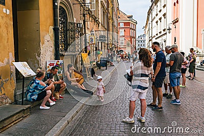Swietojanska street is in Warsaw Old town and at one end connects to Old town square and then to castle square Editorial Stock Photo