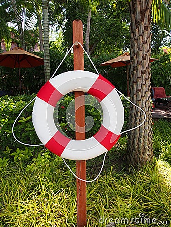 Swim ring for lifesaver on the side swimming pool Stock Photo