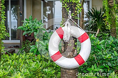 Swim ring (life buoy) for lifesaver on the side swimming pool Stock Photo