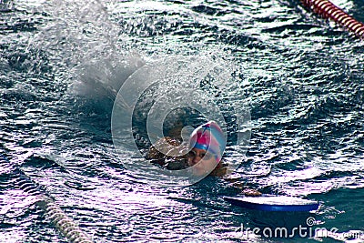 Swimmer breathing performing the crawl stroke Stock Photo