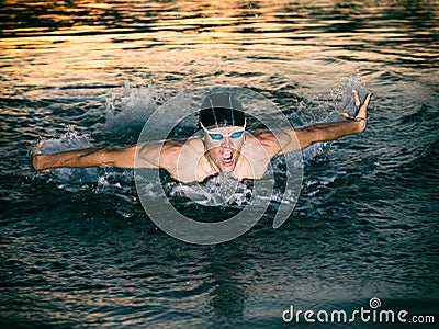 Swimmer breathing during swimming butterfly Stock Photo