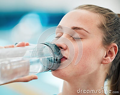 Swimmer woman, drinking water bottle or thinking for fitness, health or wellness for sport career. Athlete girl Stock Photo