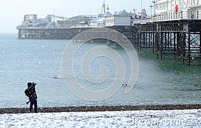 Swimmers in Brighton Beach snow Editorial Stock Photo