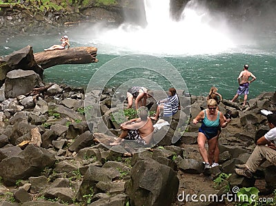 Swimmers, La Fortuna Waterfall, Costa Rica Editorial Stock Photo
