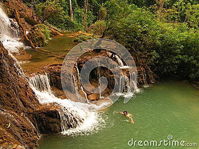 Swimmimg in tourquise Kouang Si Waterfall in Laos Stock Photo