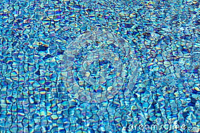 Swimming pool backgrounds. Background texture of rippled pattern of water in a swimming pool with colorful sun reflection. Macro Stock Photo