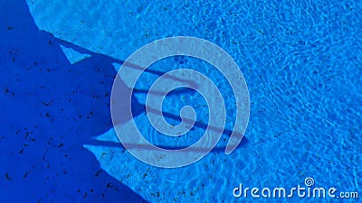 Swimming pool with blue bottom filled with water Stock Photo