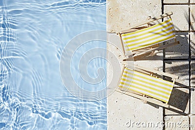 Swimming pool and empty resting chair with shadow. Top view. Stock Photo