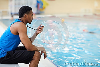 Swimming Pool Guard on Duty Stock Photo