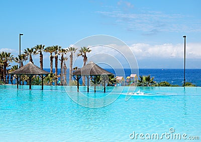 Swimming pool with jacuzzi and beach Stock Photo