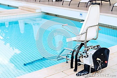 Swimming pool lifts for disabled people access to the pool. Stock Photo