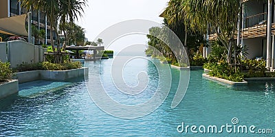 Swimming pool of luxury hotel. Empty swimming pool filled with water. Travel concept, travelling. Hotel business. Stock Photo