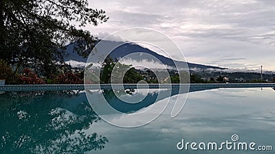 Swimming pool mountain mirror reflector Stock Photo