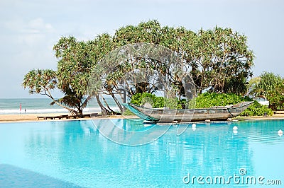 The swimming pool and old traditional boat Stock Photo