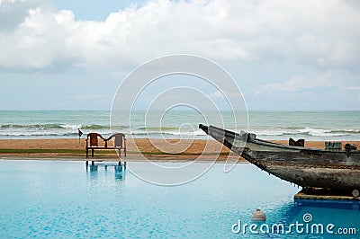 The swimming pool and old traditional boat as decoration Stock Photo