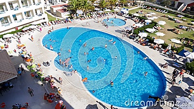 Swimming pool with people - holidays concept Editorial Stock Photo