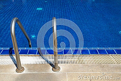 Swimming pool with sunny reflections on good weather day. Relax time with family on swimming pool. Popular sport Stock Photo