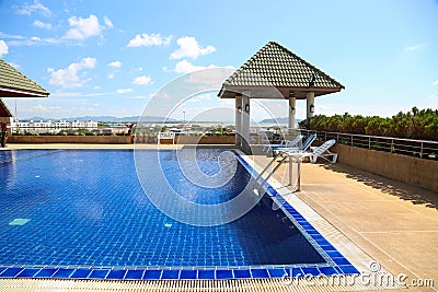 Swimming pool with sunny reflections on good weather day. Relax time with family on swimming pool. Popular sport Stock Photo