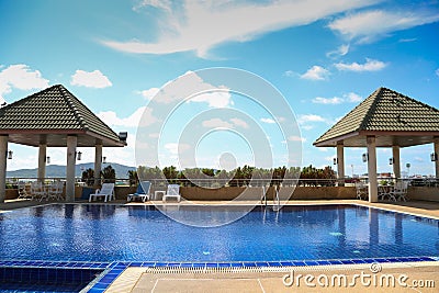Swimming pool with sunny reflections on good weather day. Relax time with family on swimming pool. Popular sport Stock Photo