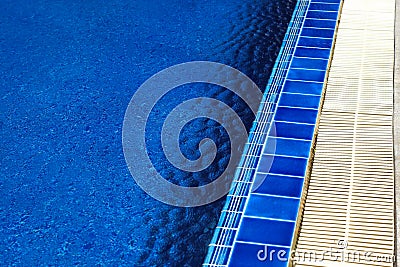 Swimming pool with sunny reflections on good weather day. Relax time with family on swimming pool. Popular sport Stock Photo