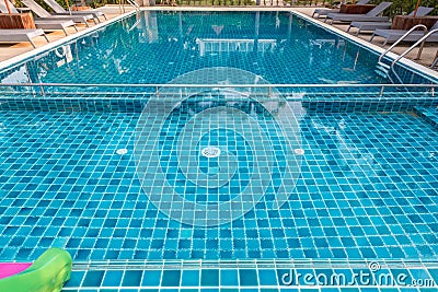 Swimming Pool.swimming pool bottom caustics ripple and flow with waves background.Swimming pool of luxury hotel Stock Photo