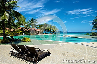 Swimming pool vacation resort with recliner in Boracay Stock Photo