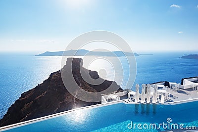 Swimming pool with a view on Caldera over Aegean sea, Santorini, Greece Stock Photo