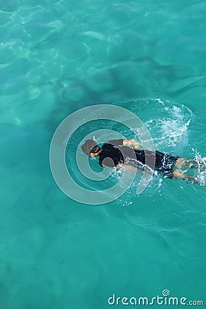 SWIMMING IN THE SEA Stock Photo