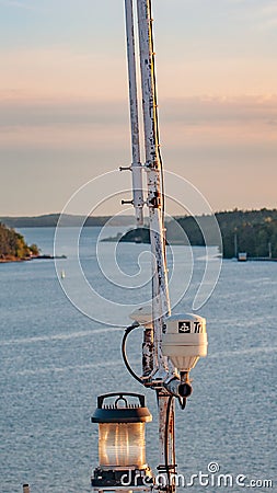 Swimming in the straits of the Baltic Sea, near the Finnish city of Turku, warm evening. Signal devices on the ferry mast Editorial Stock Photo