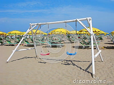 Swing, beach, tourist resort, playground by sea Editorial Stock Photo