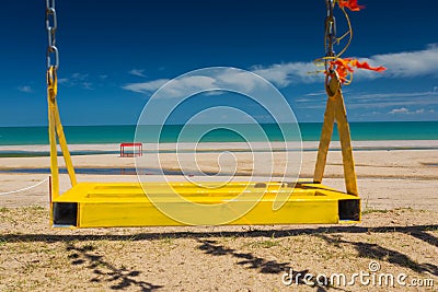 Swing on the beach Stock Photo