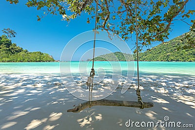 Swing and Beautiful beach for relaxation, Located Surin Island, Stock Photo