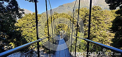 Swing bridge at Blue Pools track, Makarora River, New Zealand`s South Island Stock Photo