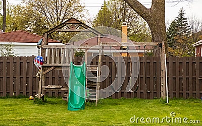 Swing set in backyard during spring season Stock Photo