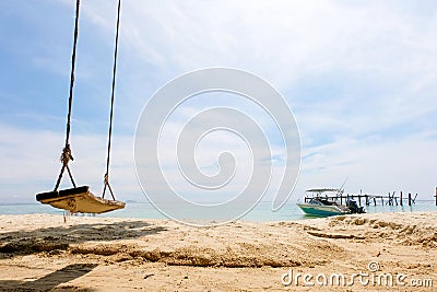 Swing under the tree at Samet island, sun of summer time on sky and sand of beach relaxation landscape viewpoint. Editorial Stock Photo