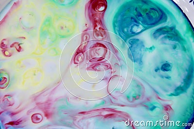 Swirling Milk and Colors Stock Photo