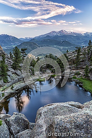 Swirling Sunset Clouds above Gem Lake and Longs Peak Stock Photo