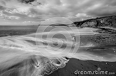 Swirling Surf, Hemmick beach, Cornwall Stock Photo
