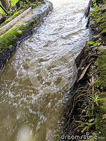 Swirls and streams of turbid water Stock Photo