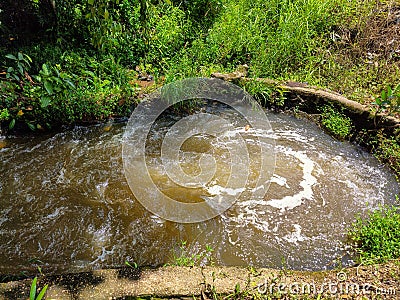 Swirls and streams of turbid water Stock Photo