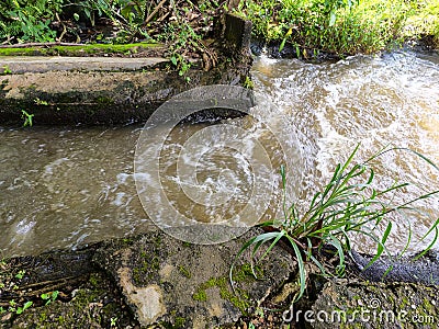 Swirls and streams of turbid water Stock Photo