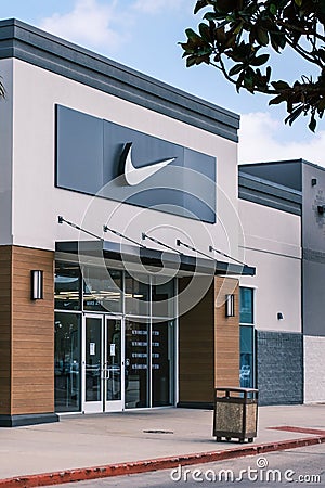 The Swish Logo Looms Over the Entrance to the Nike Store in the Elmwood Shopping Center Editorial Stock Photo
